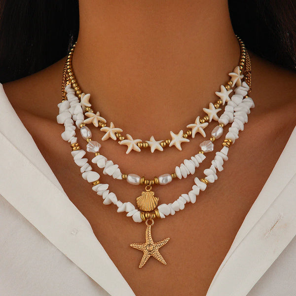 Pearl necklace with gold pendant with star
